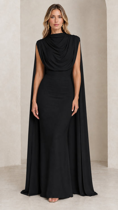 Front view of model wearing the black draped cowl neck cape evening gown