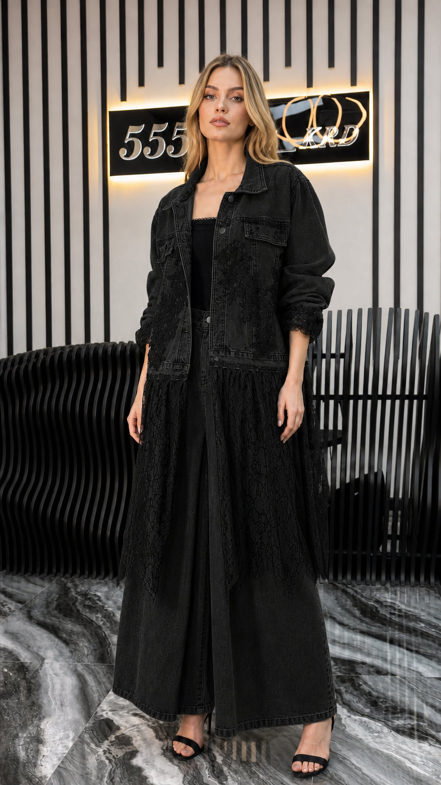 Front view of model wearing all black denim long jacket and pants set with lace trim