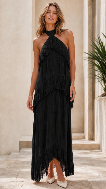 Model wearing black halter neck tiered fringe maxi dress