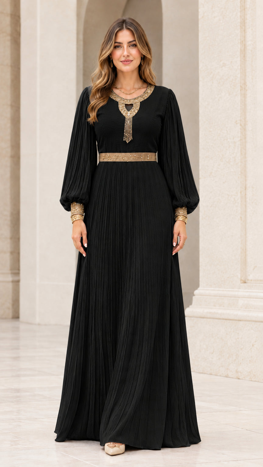 Front view of black pleated long sleeve maxi dress with gold embroidered accents