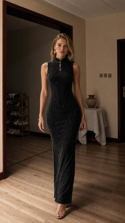 Full view of model in black metallic maxi dress