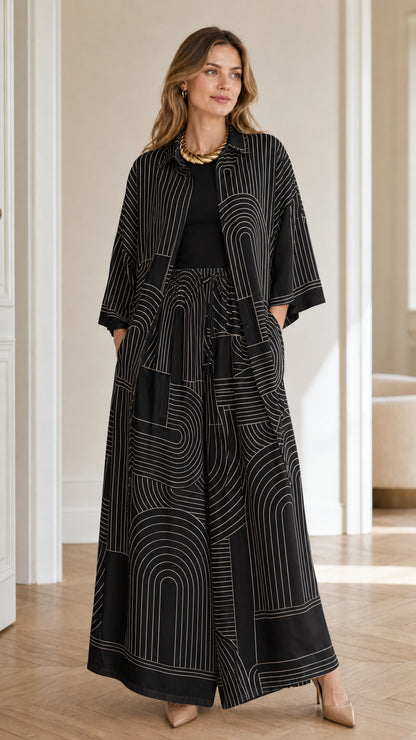 Model wearing black geometric print matching set