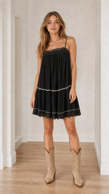 Model wearing black boho tiered camisole dress