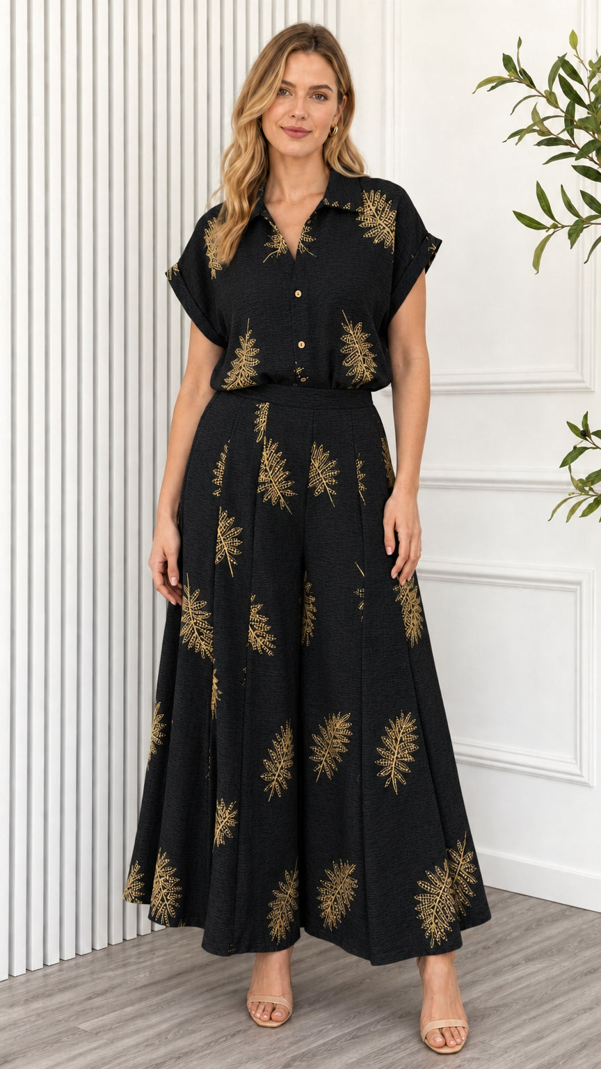 Model wearing black leaf print two piece set