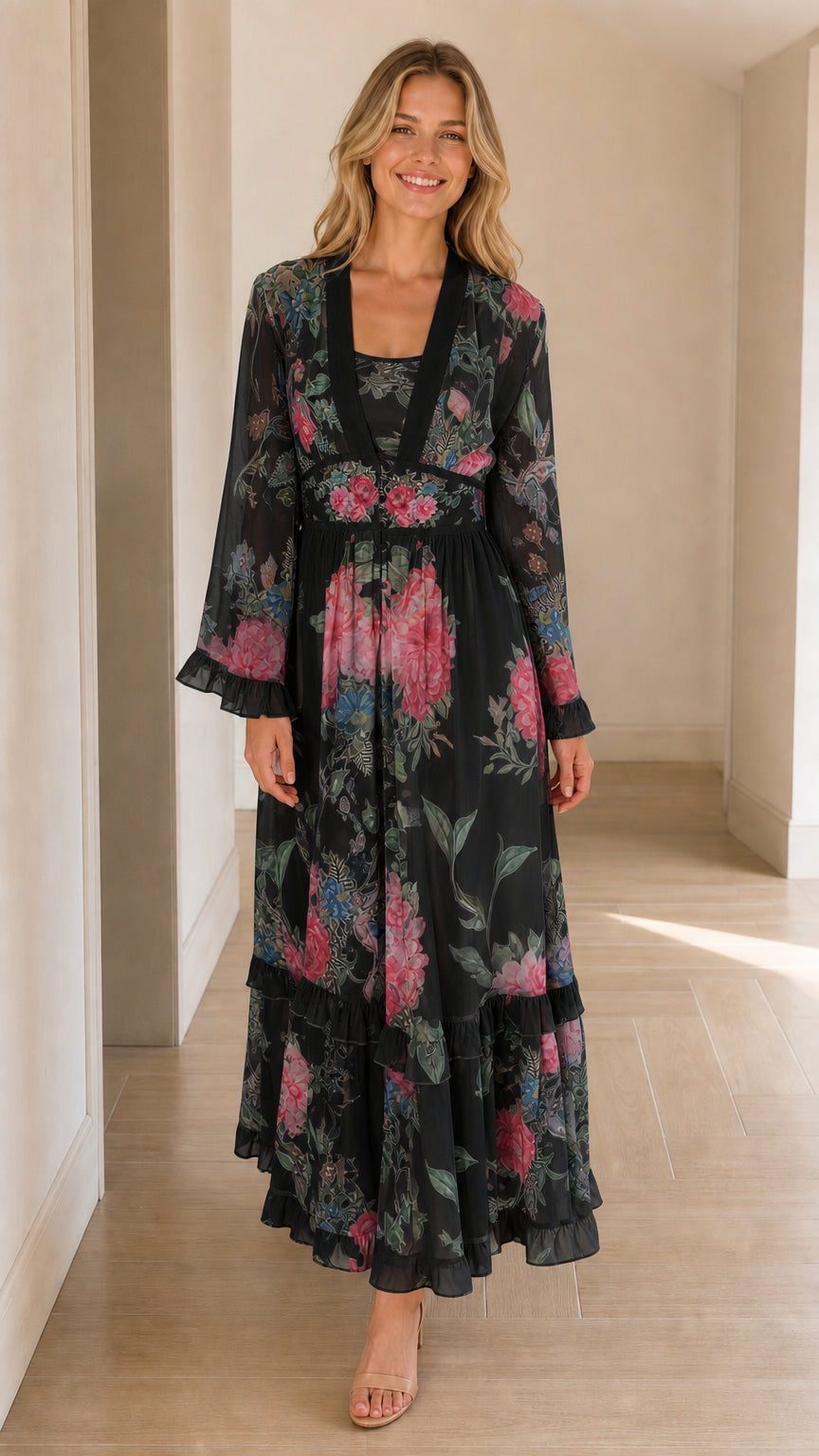 Full-length front view of black floral long sleeve chiffon maxi dress