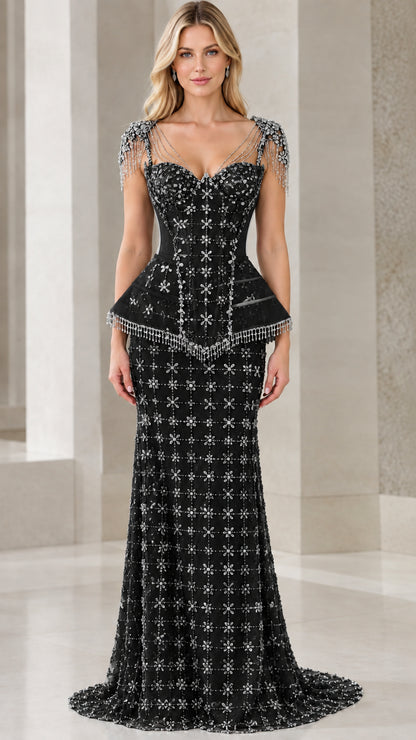 Front view of model wearing black beaded corset peplum evening gown