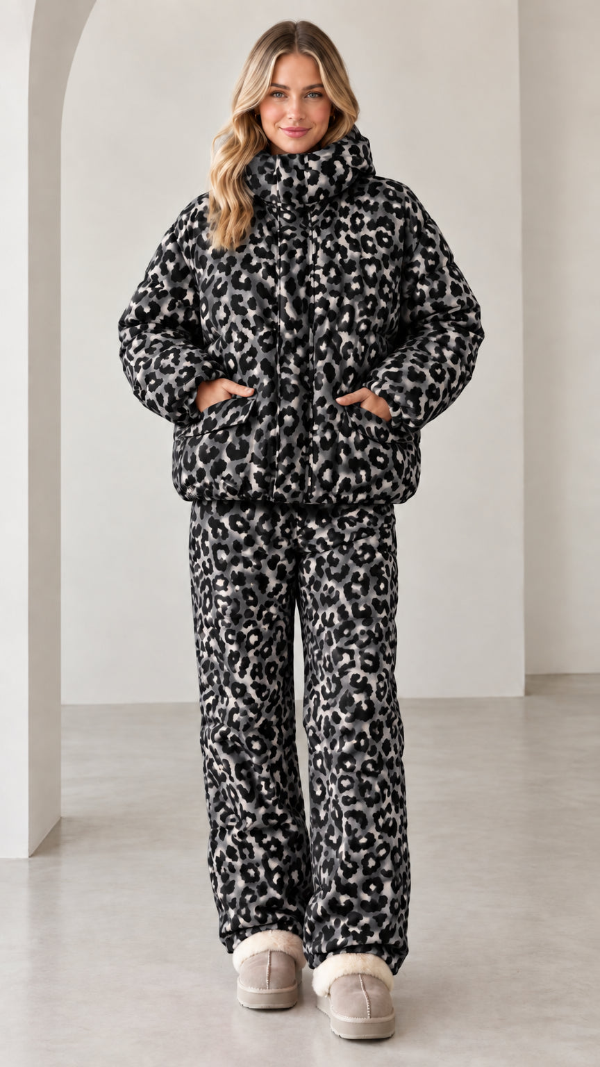Full front view of model wearing black and grey leopard print puffer set