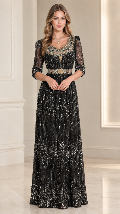 Front view of black beaded 3/4 sleeve evening gown with crystal waistband