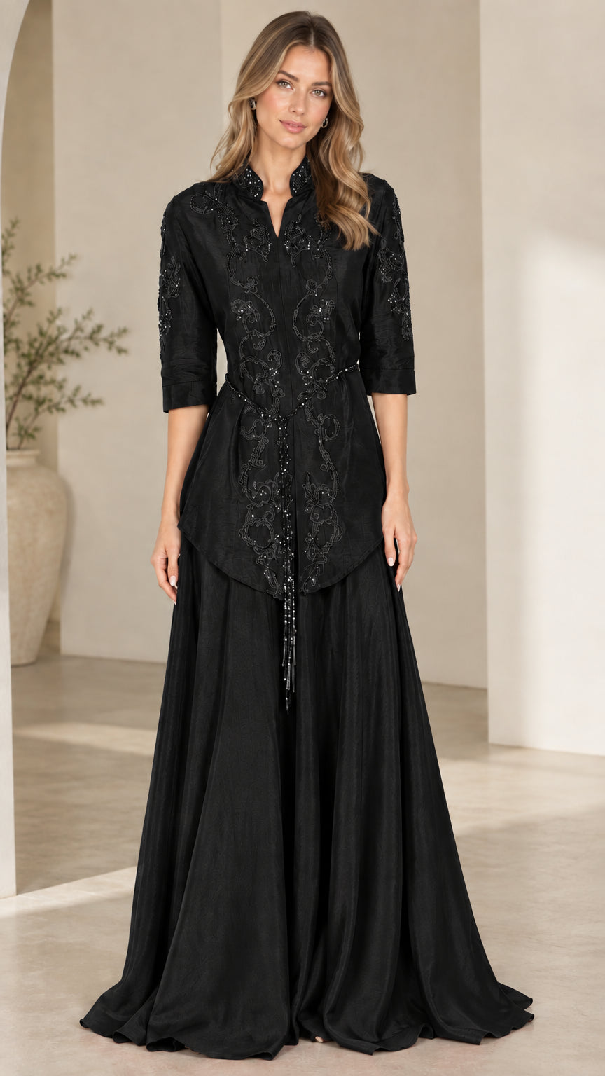 Front view of black embroidered 3/4 sleeve formal evening maxi gown