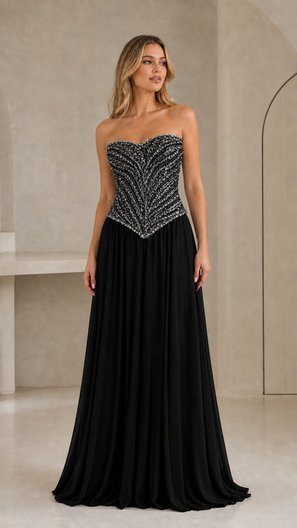 Full-length front view of black strapless sequin basque waist formal evening dress