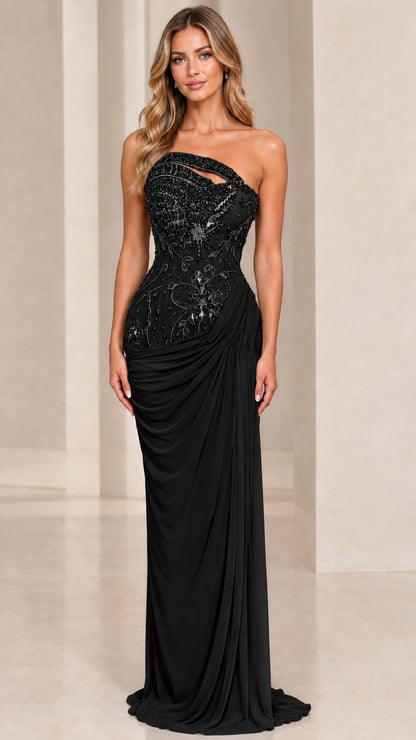 Front view of model wearing black asymmetrical beaded evening gown