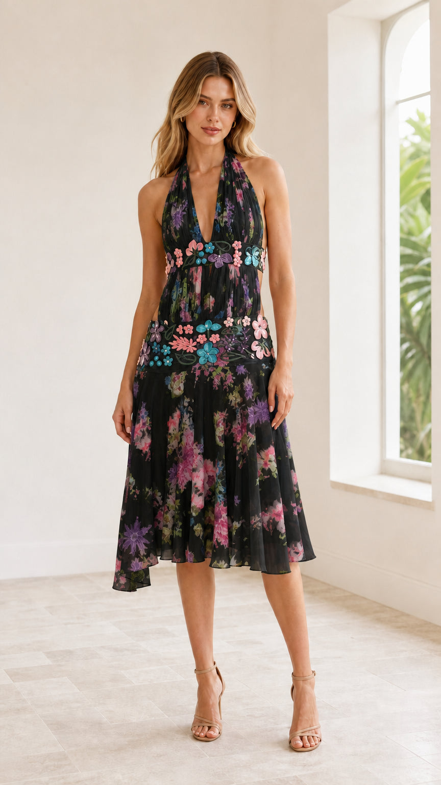 Front view of model wearing Black floral halter cutout midi dress
