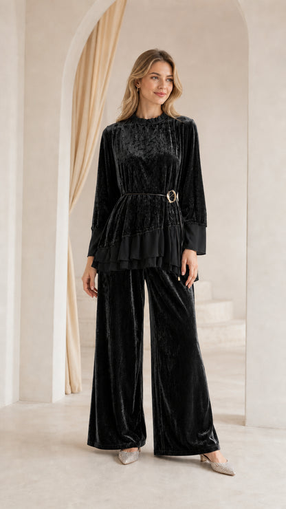Front view of woman wearing black crushed velvet two-piece pant set