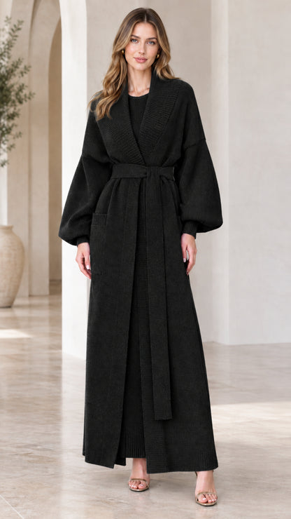 Full-length view of woman wearing black belted maxi knit duster cardigan set