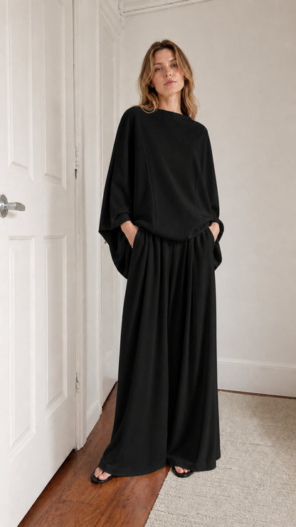 Model wearing black lounge set