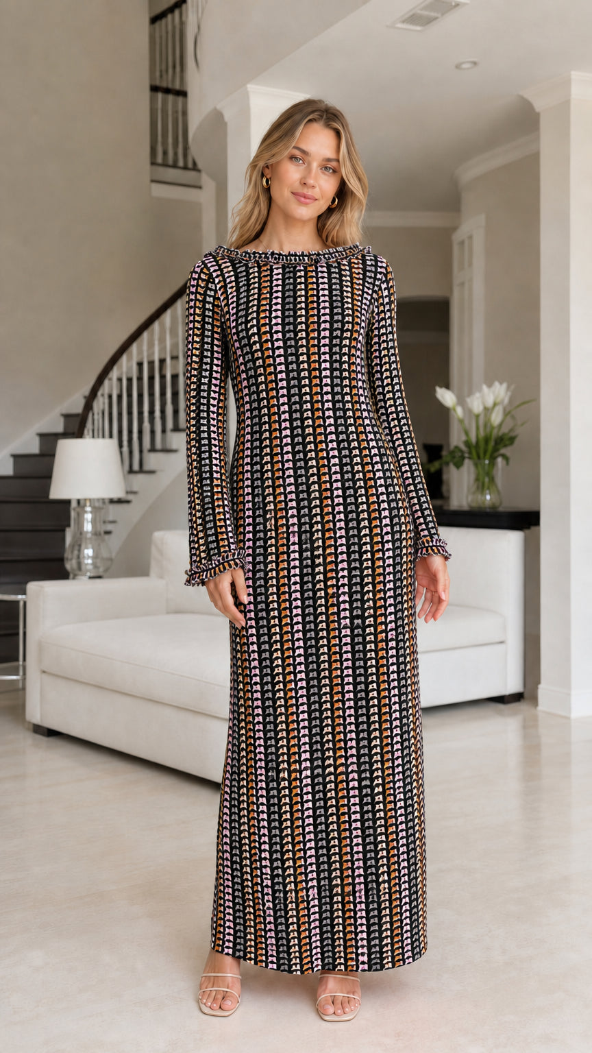 Front view of model wearing black striped crochet maxi dress