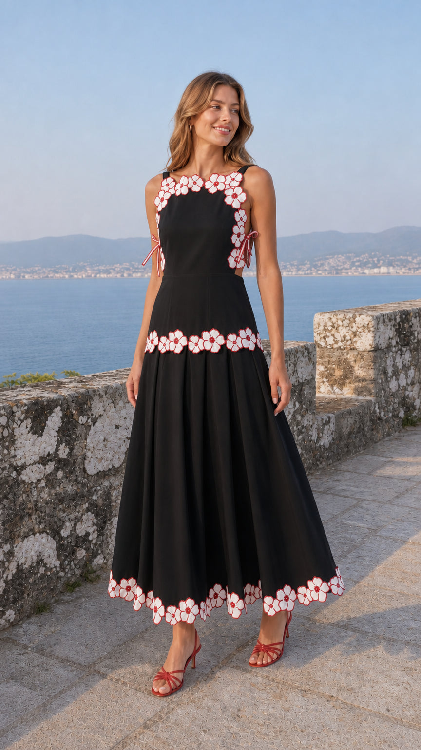 Woman wearing black variant of the embroidered floral midi dress