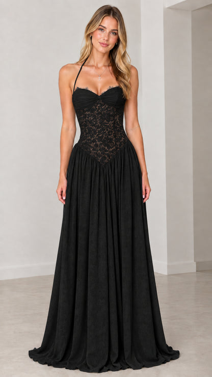 Front view of model wearing black lace halter basque waist maxi dress