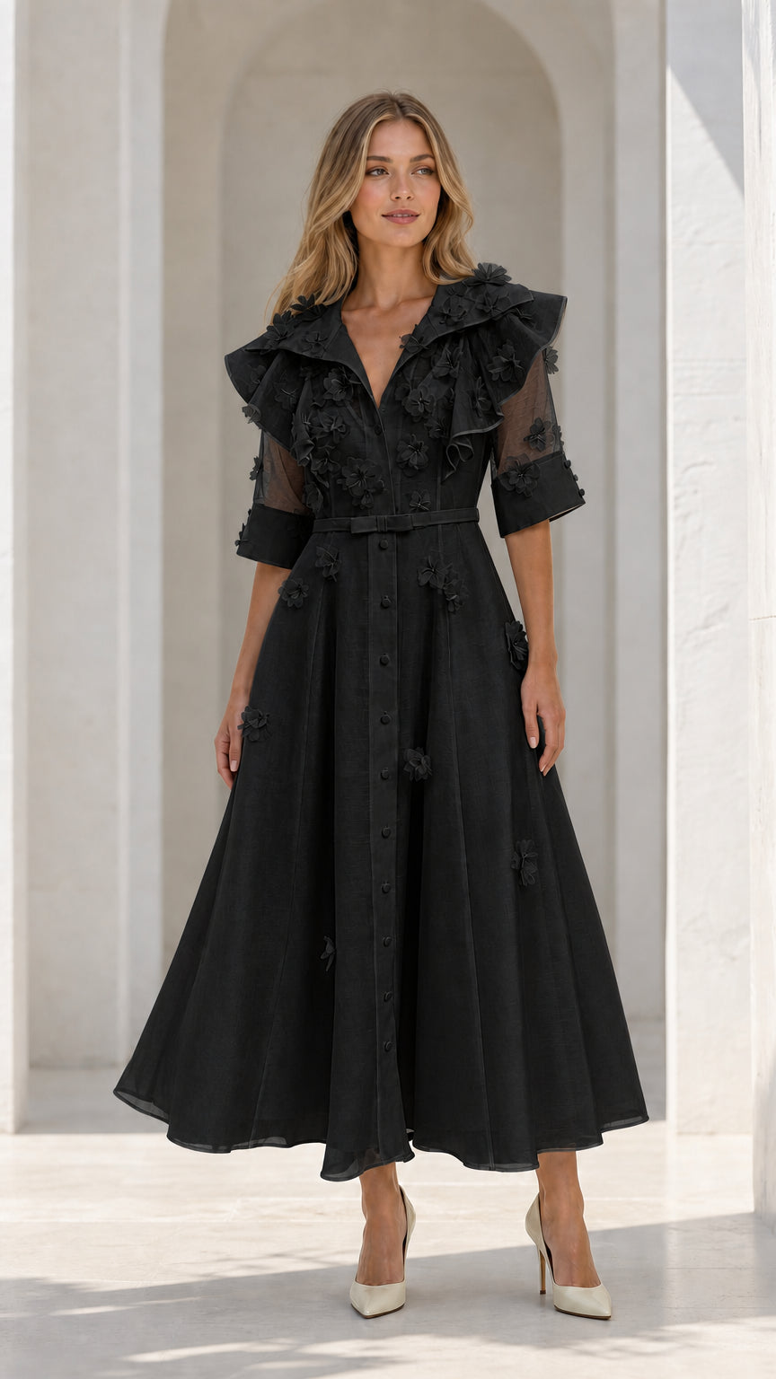 Model wearing black floral applique ruffle midi dress