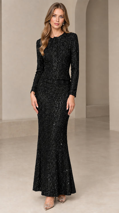 Front view of model wearing Black sequin long sleeve jacket and matching maxi skirt set