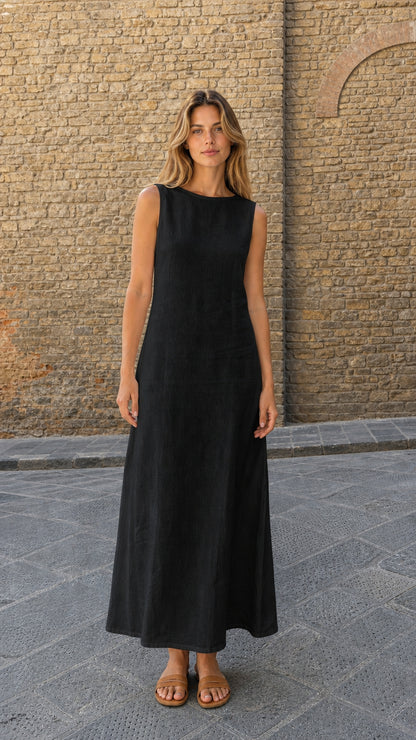 Model wearing black sleeveless open back maxi dress