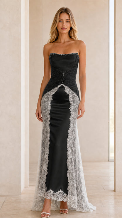 Front view of black strapless evening gown with silver lace trim