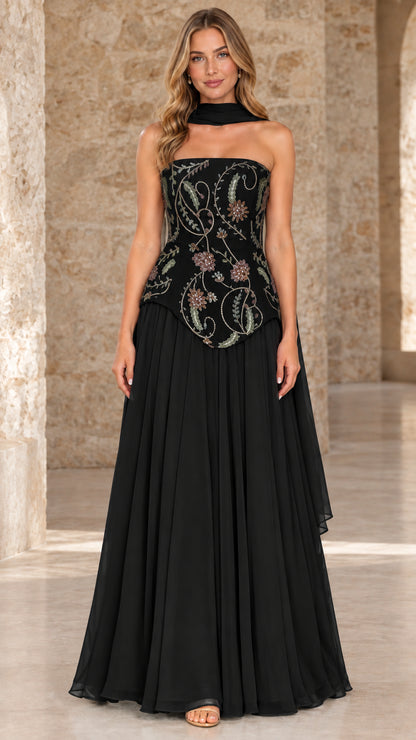 Front full view of black strapless evening dress with contrast floral embroidery