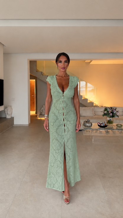 Model wearing sage green lace maxi dress, front view