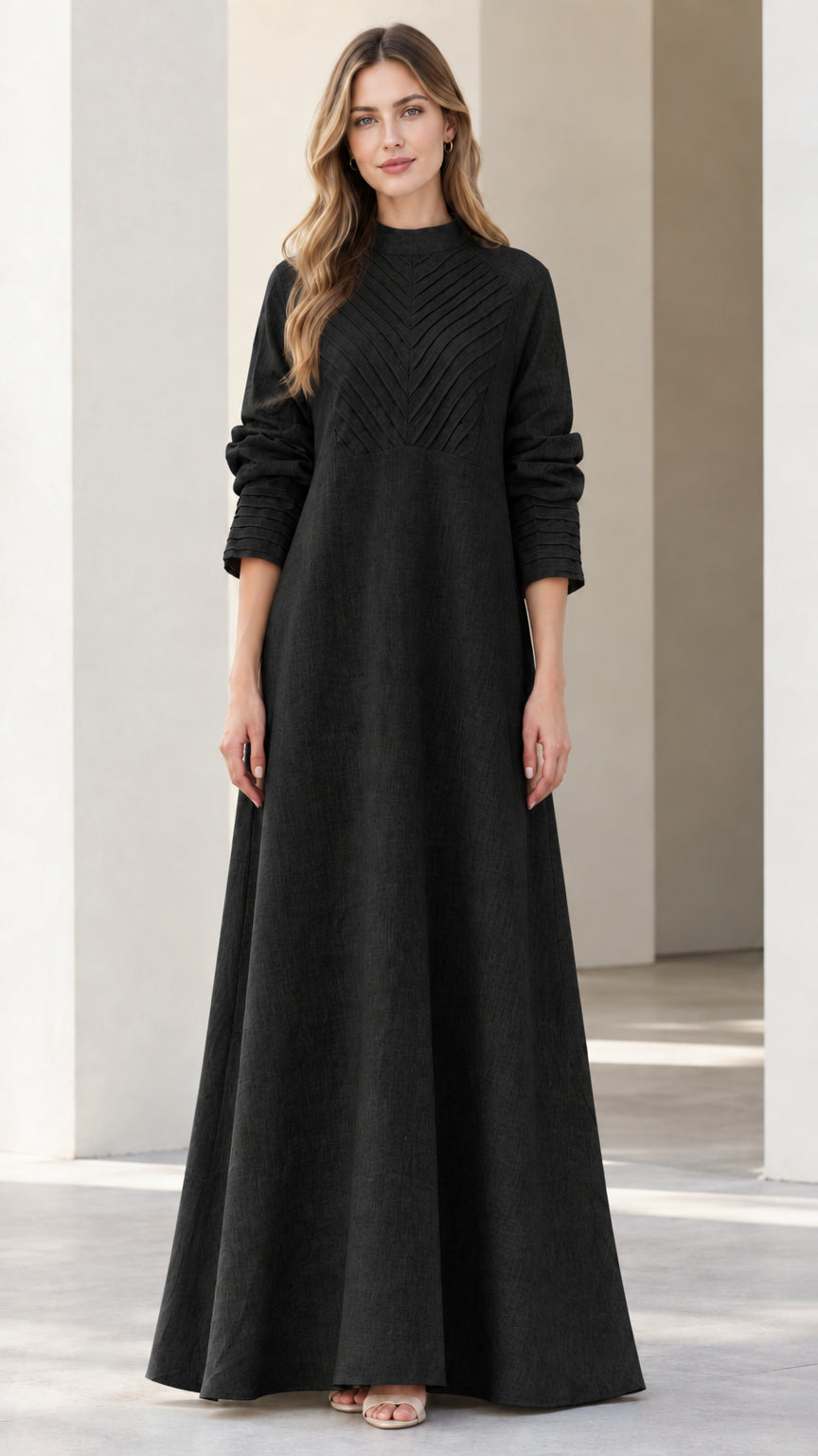 Front view of black long sleeve mock neck pleated maxi dress