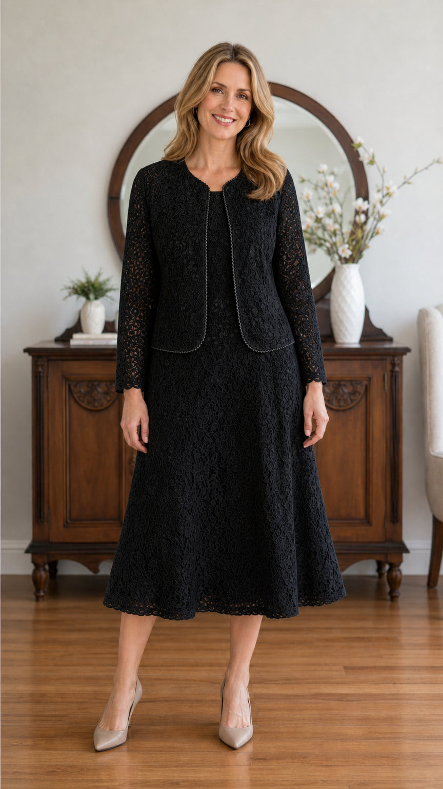 Full front view of model wearing the Black lace midi dress and jacket two-piece set