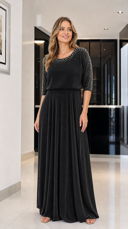 Model wearing black beaded pleated maxi dress