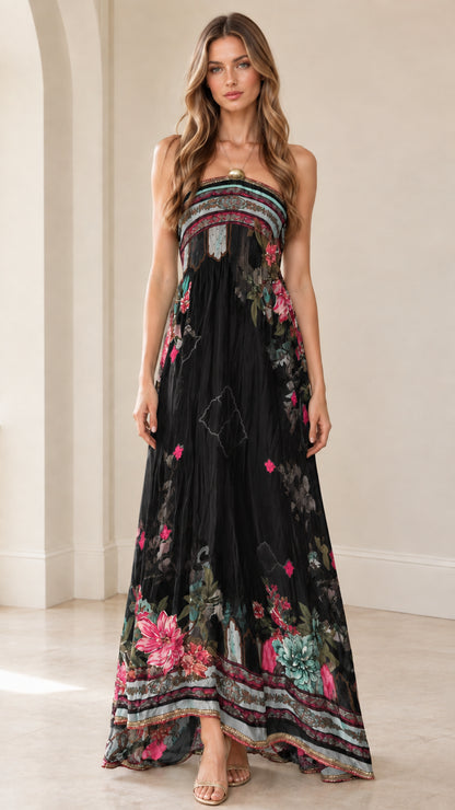 Front view of woman wearing black strapless floral border maxi dress