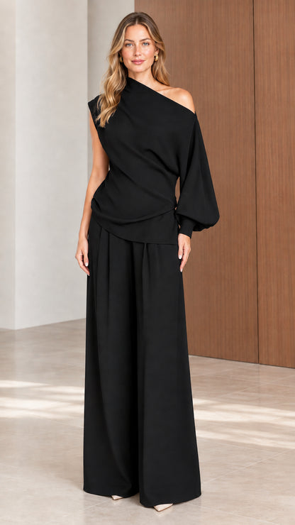 Front view of model wearing Black one-shoulder top and wide-leg trousers set