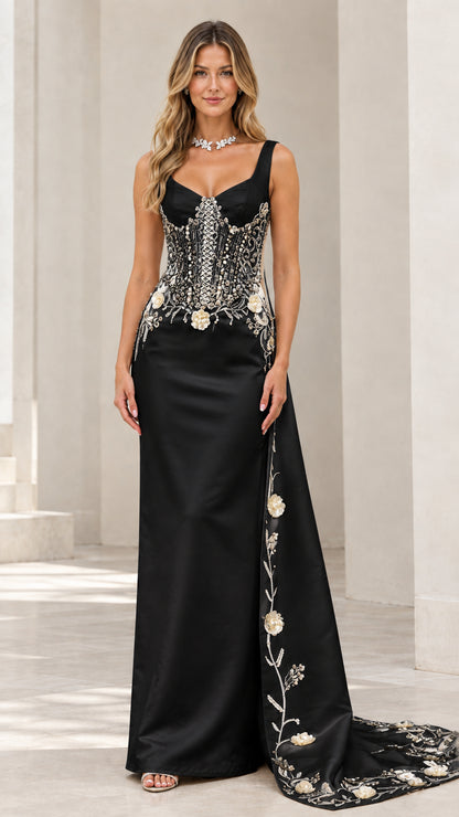 Full front view of black corset evening gown with silver floral embroidery and train