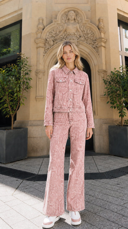 Full view of model wearing pink snake print denim matching set