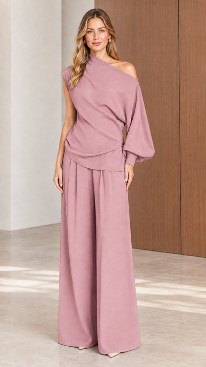 Front view of model wearing Dusty Rose one-shoulder draped top and wide-leg pants set