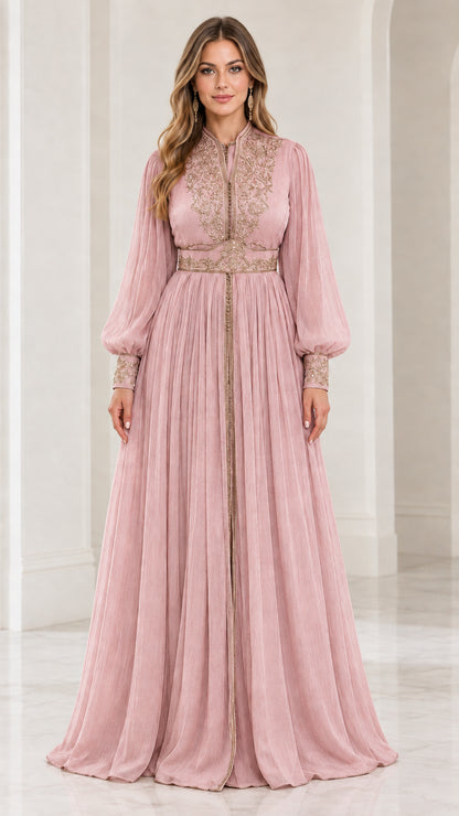 Front view of model wearing dusty pink embroidered long sleeve pleated kaftan gown