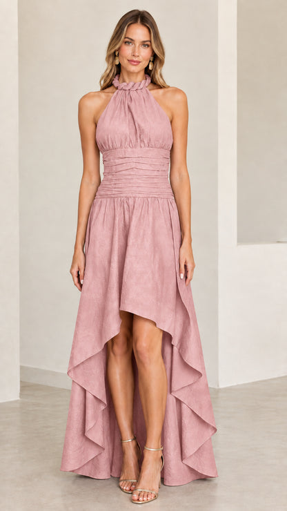 Model wearing dusty pink halter neck ruched waist formal dress