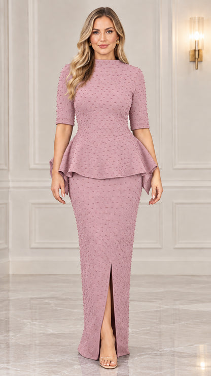 Front view of model wearing dusty pink beaded peplum maxi evening dress