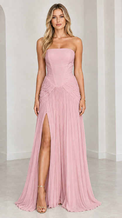 Model wearing dusty pink strapless corset pleated evening dress