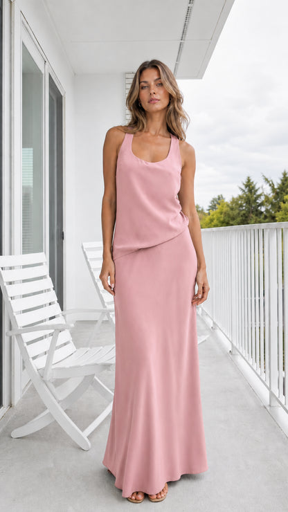 Model wearing dusty pink scoop neck sleeveless maxi dress