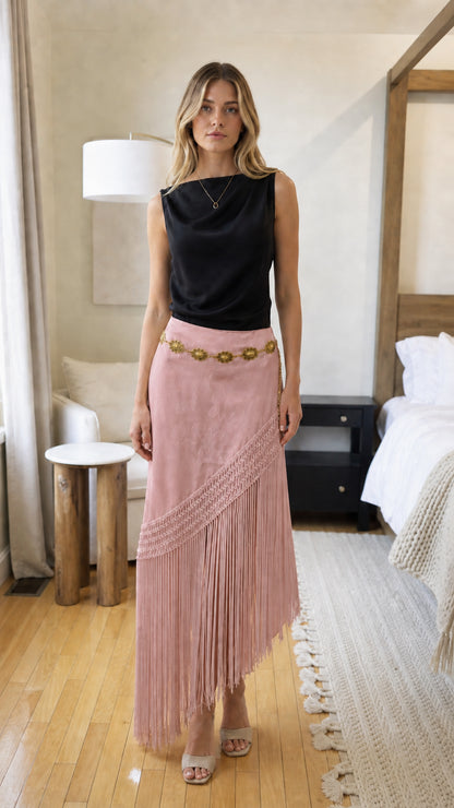 Woman wearing pink bohemian fringe long skirt
