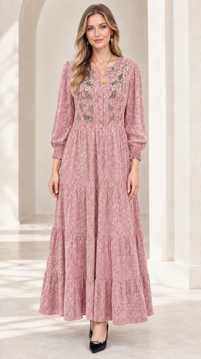 Front view of model wearing dusty pink long sleeve tiered maxi dress