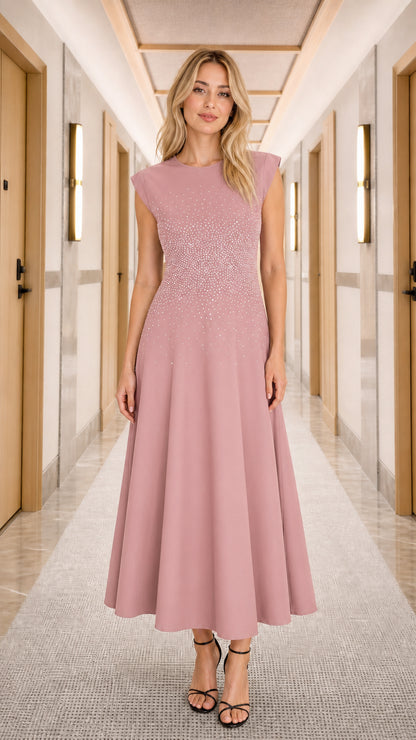 Woman wearing dusty pink rhinestone embellished cap sleeve A-line midi dress
