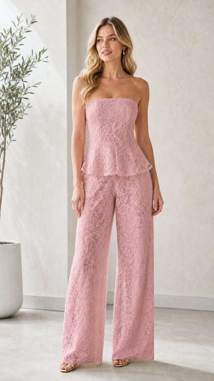 Model wearing dusty pink strapless lace peplum wide leg jumpsuit