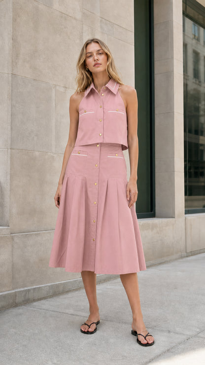 Blush pink sleeveless collared top and pleated midi skirt set shown from the front