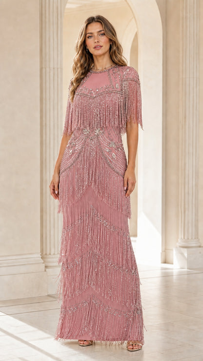 Front view of woman wearing dusty rose pink sequin beaded fringe formal dress