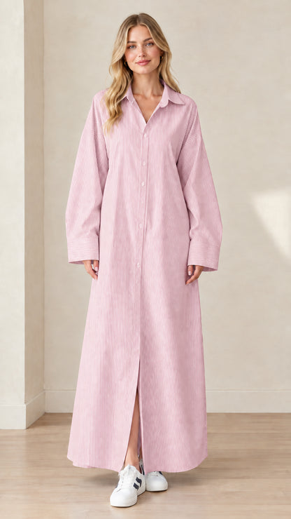 Front view of a model wearing a soft pink and white striped maxi shirt dress