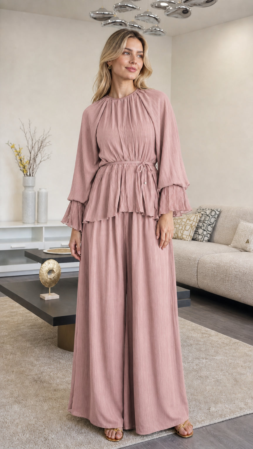 Front view of woman wearing Dusty Pink pleated peplum top and pants set