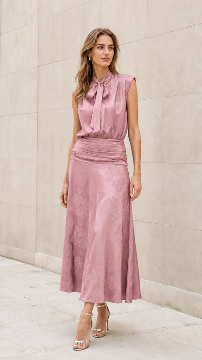 Front view of model wearing pink tie-neck midi dress